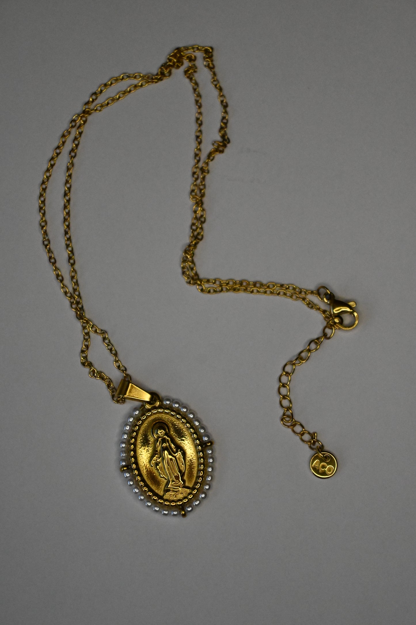 Medalha com santos